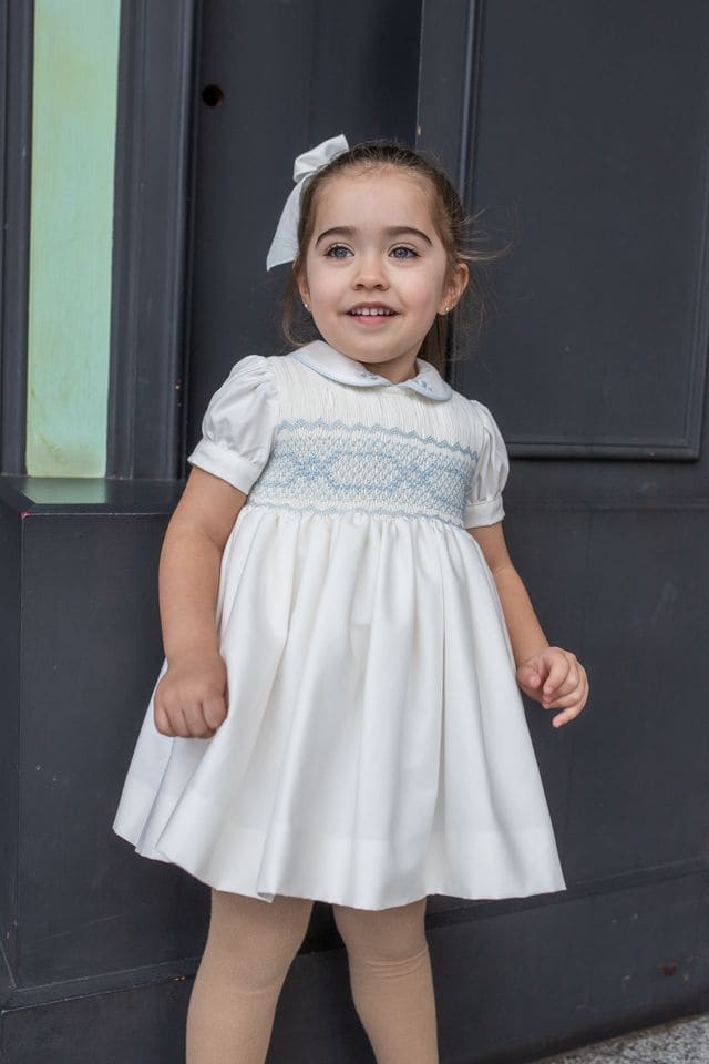 Naxos Ivory & Blue Hand Smocked Dress With Bow On The Back - 7622
