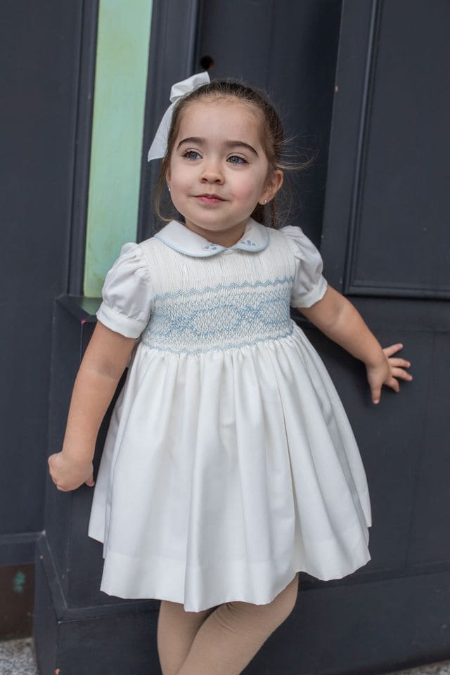 Naxos Ivory & Blue Hand Smocked Dress With Bow On The Back - 7622