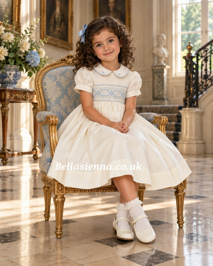 Naxos Ivory & Blue Hand Smocked Dress With Bow On The Back - 7622