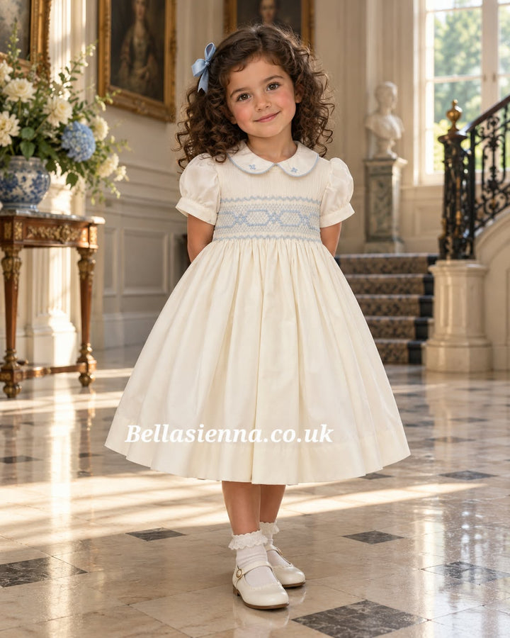 Naxos Ivory & Blue Hand Smocked Dress With Bow On The Back - 7622