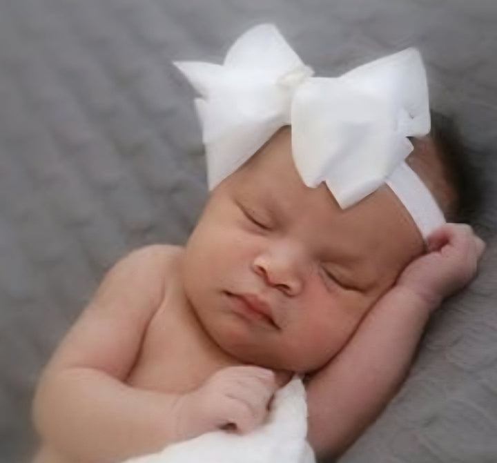 Bowtique London -   White Satin Bow Headband With Diamante