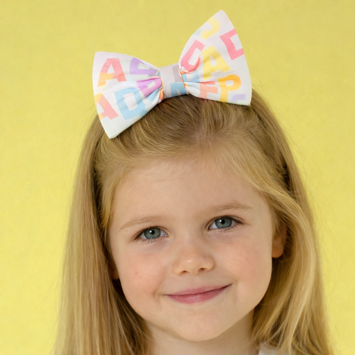 A Dee - S262920 SAMI - Initial print bow hair clip