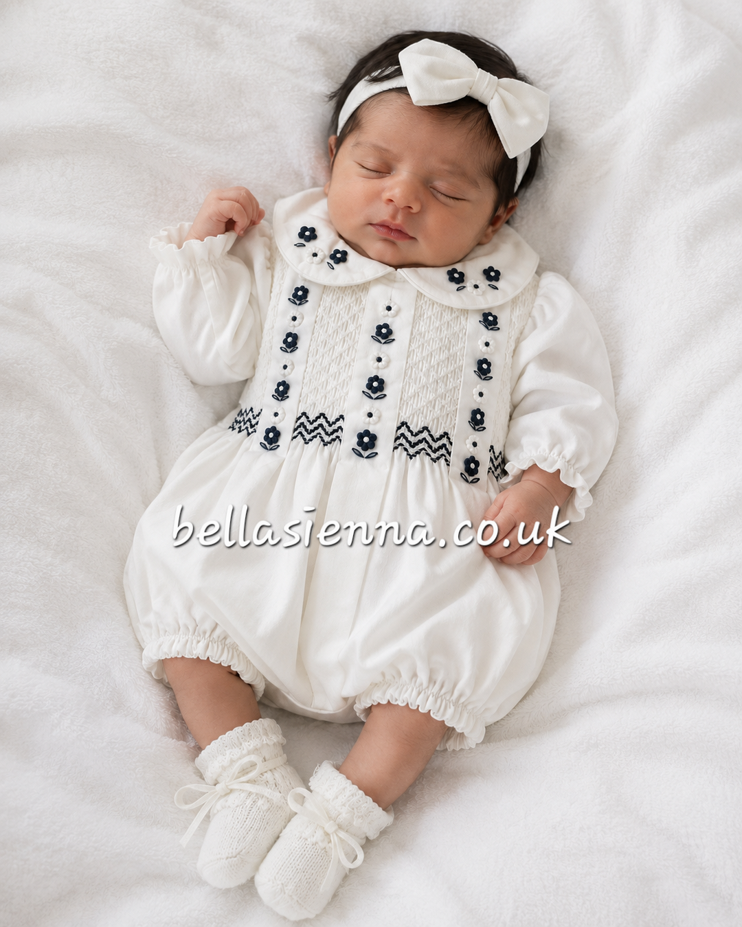 Sarah Louise Baby Girls Ivory & Navy Hand Smocked Bubble Romper - 013922